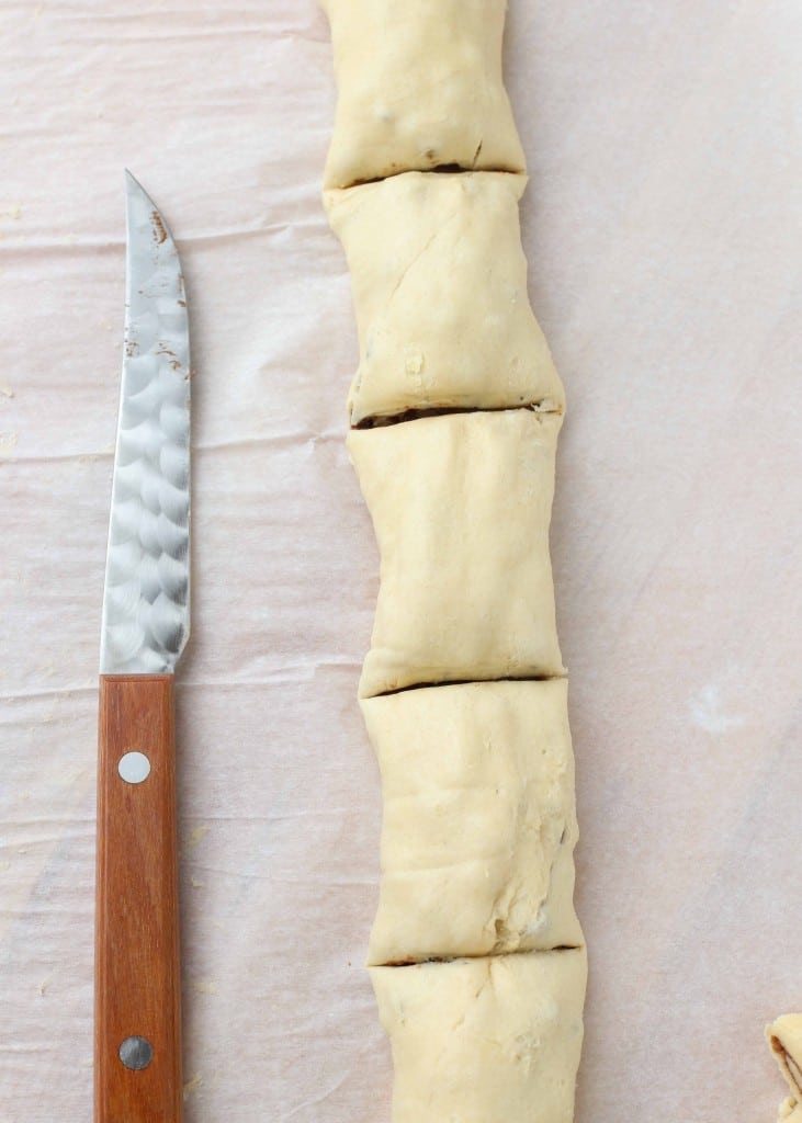 Overhead vertical shot of sliced wrapped puff pastry in a row