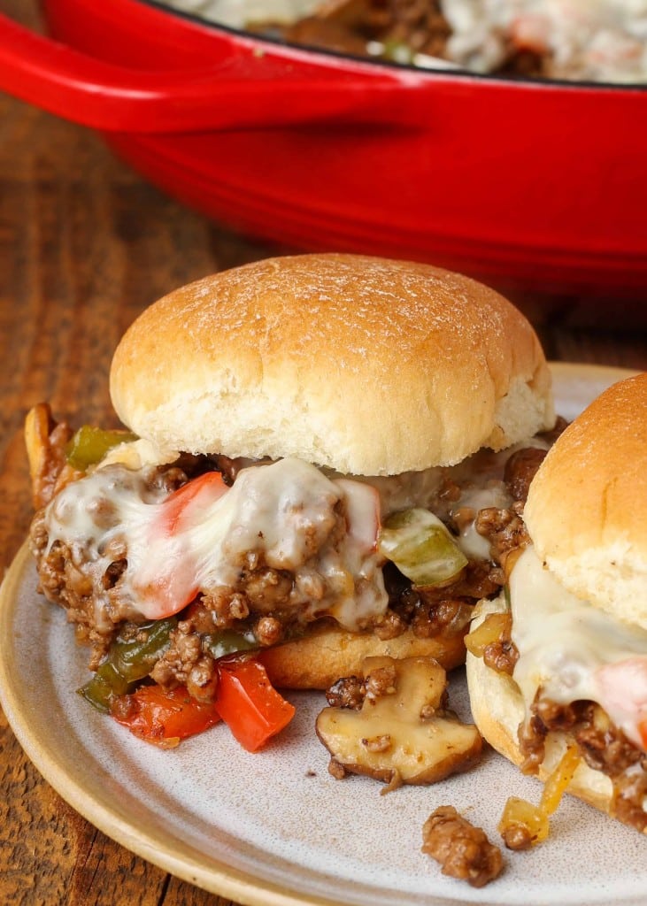 close up of cheesesteak slider on pottery plate