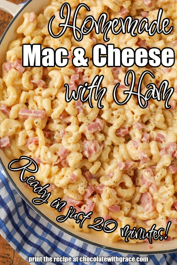 White lettering has been overlaid this top down shot of a pan of mac and cheese with ham. It reads, "Mac and Cheese with Ham".