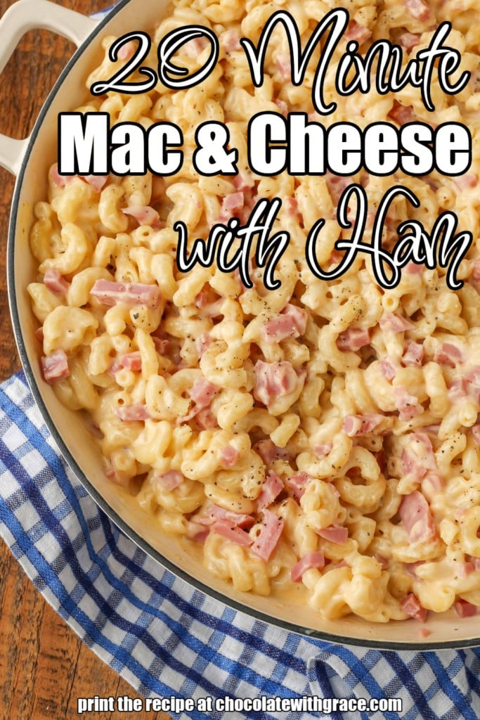 White lettering has been overlaid this top down shot of a pan of mac and cheese with ham. It reads, "Mac and Cheese with Ham".