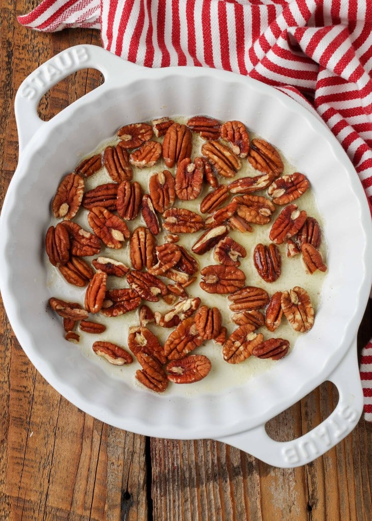 pecans and butter in white pie plate