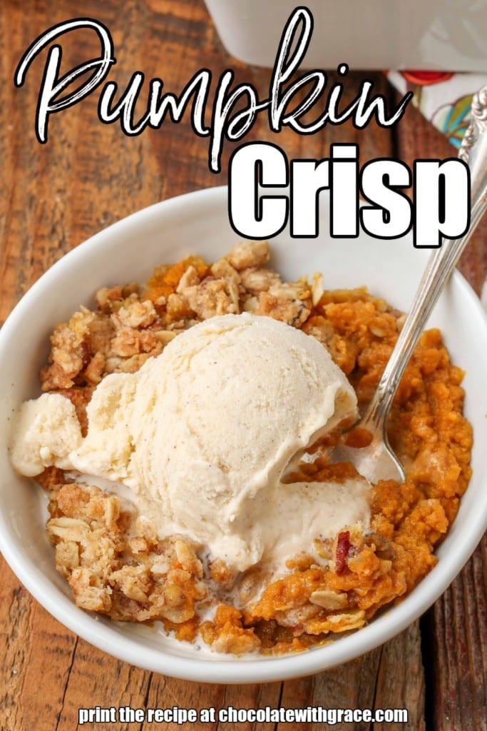 White lettering has been overlaid this image of a serving of pumpkin crisp, topped with a scoop of vanilla ice cream. It reads, "Pumpkin Crisp".