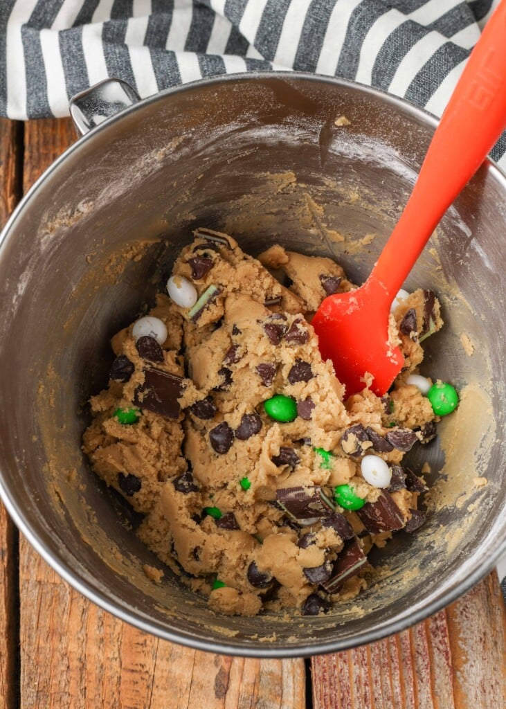 mint chocolate candies stirred into cookie dough