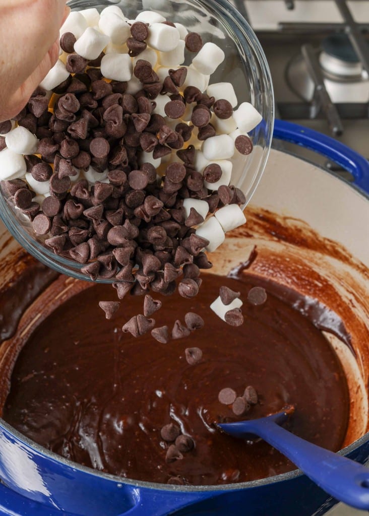 Adding chocolate and mini marshmallows to batter
