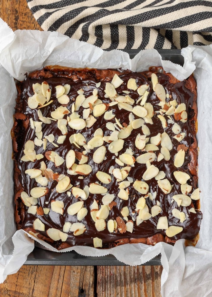 Overhead shot of Rocky Road Brownies topped with frosting and sliced almonds