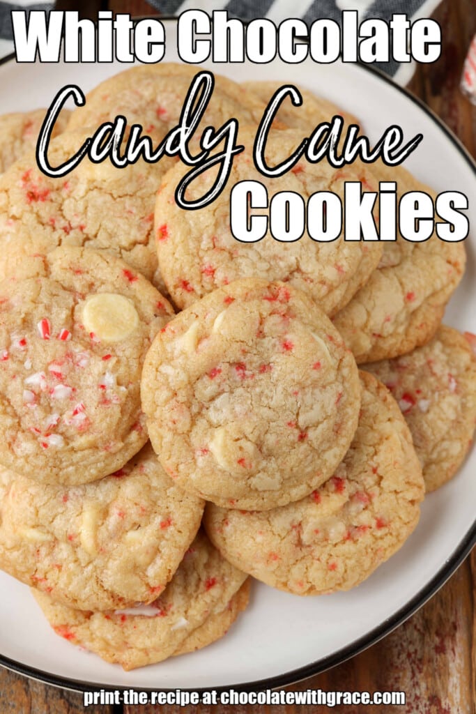 White chocolate chip cookies with candy canes stacked on plate