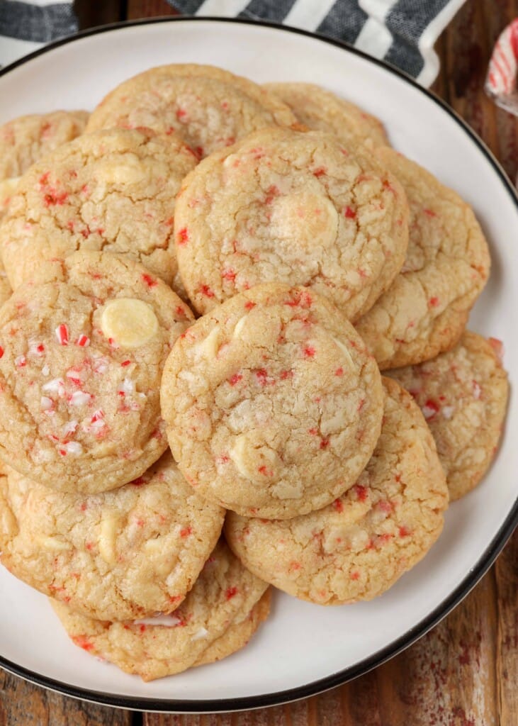 overhead photo of candy cane cookies on white plate