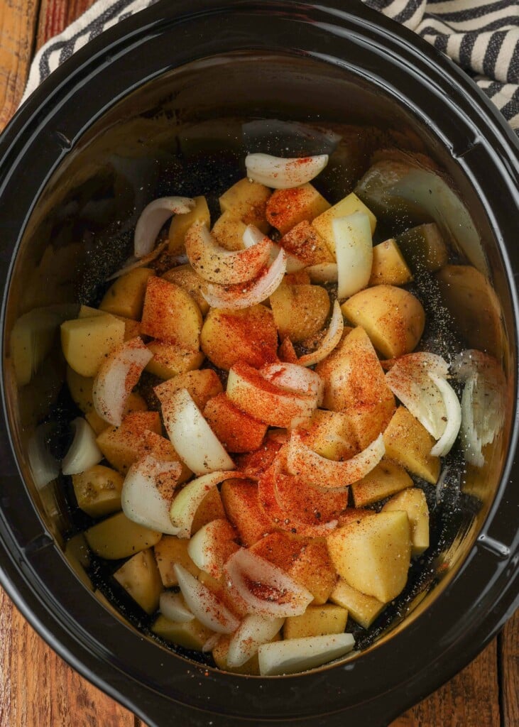 Seasoned potatoes and onions in slow cooker