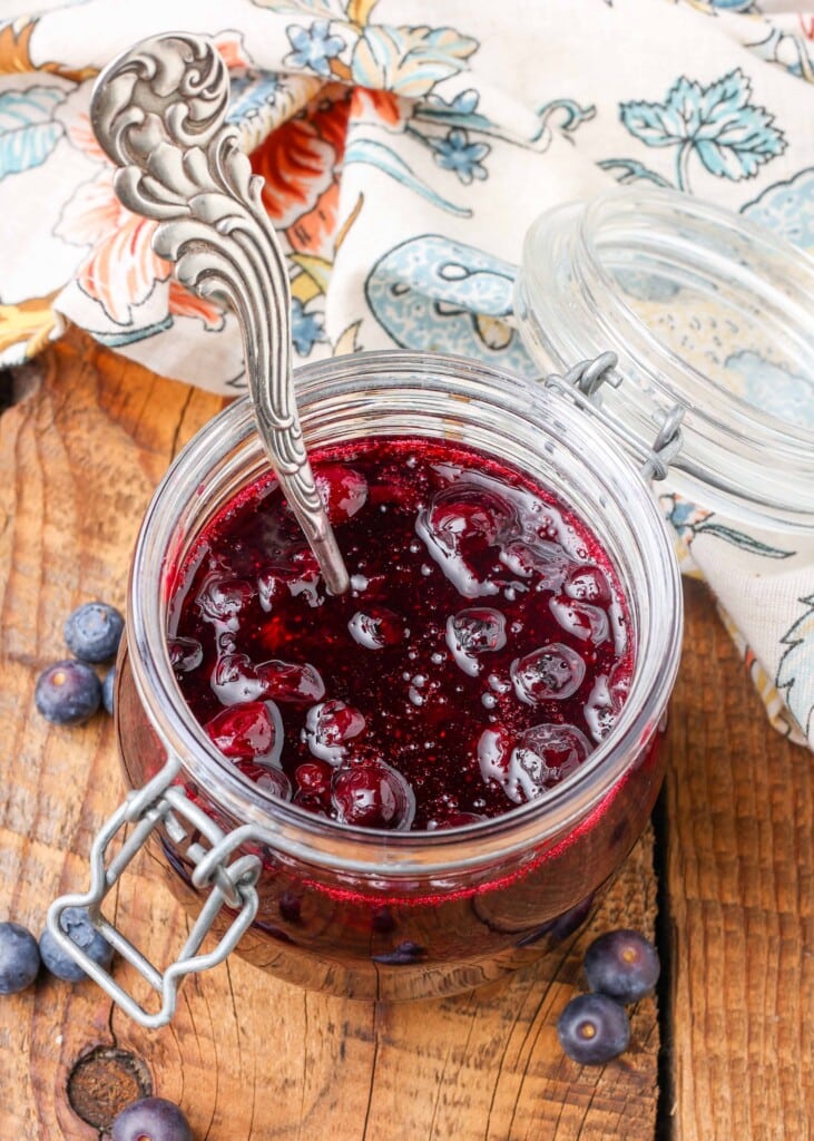 jar of blueberry sauce with spoon
