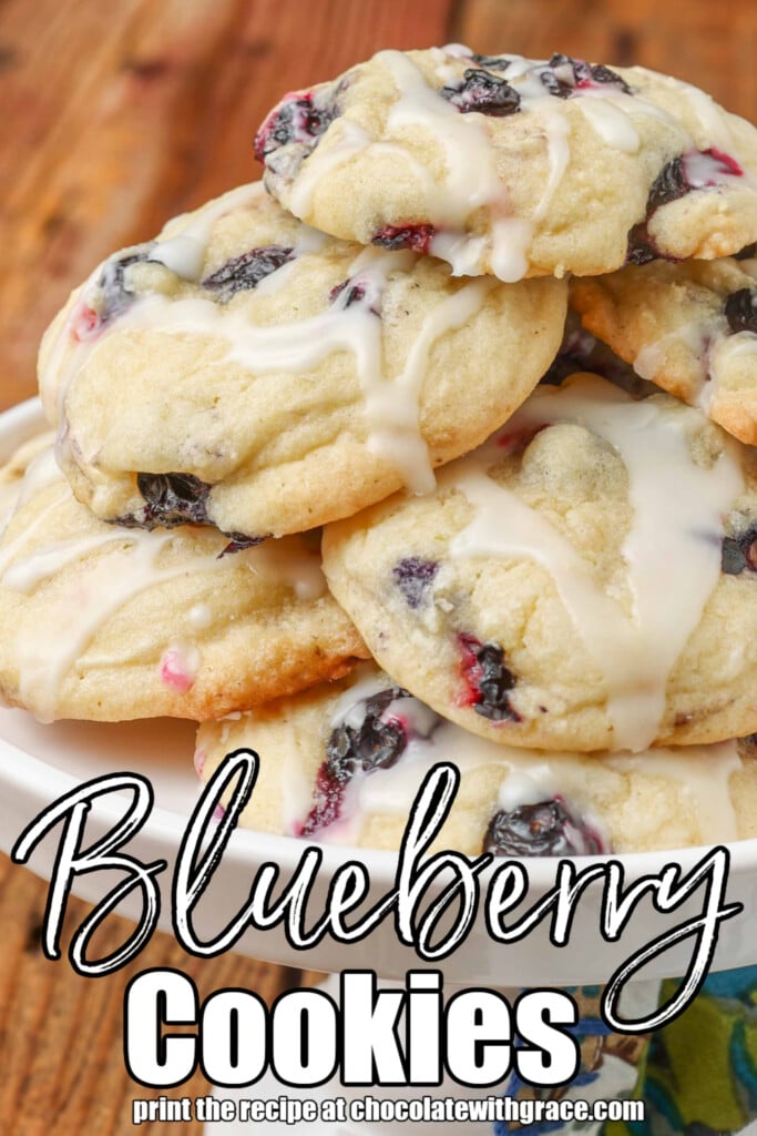 Vertical shot of glazed berry cookies stacked on tray