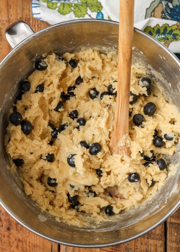 Cookie batter with blueberries in mixer