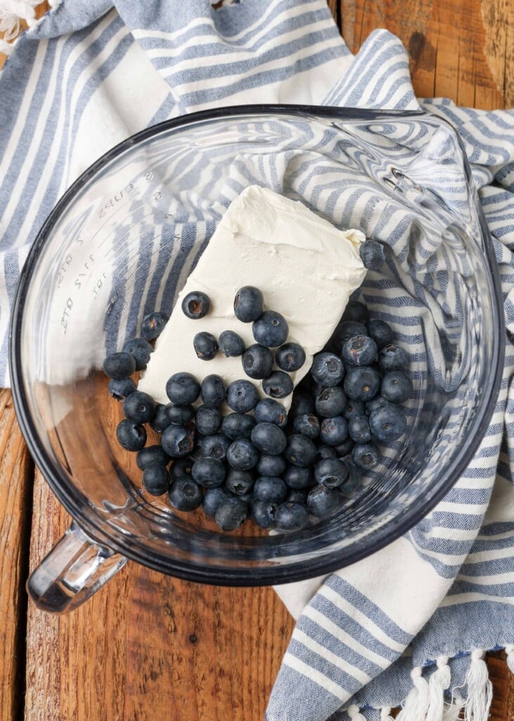 fresh blueberries and cream cheese ingredients in clear bowl