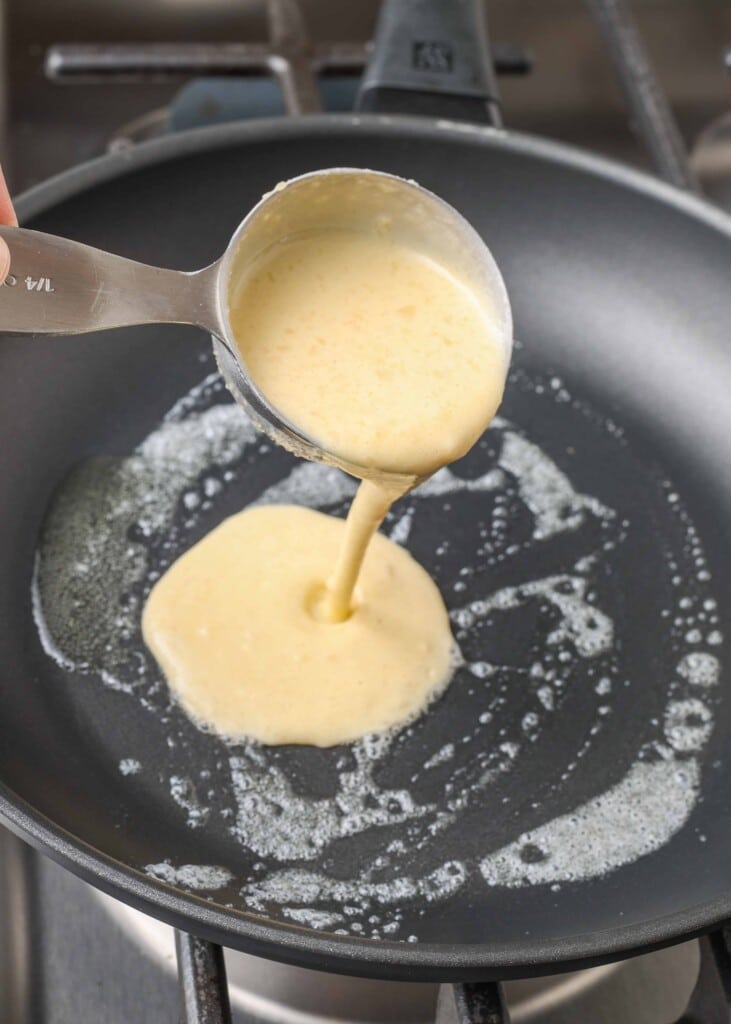 Pouring batter into buttered pan