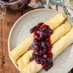 Rolled pancakes with blueberry compote