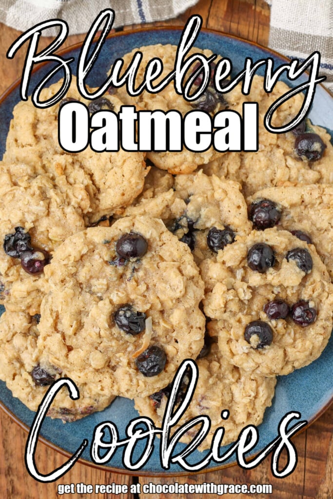 White lettering is overlaid this image of fruity oatmeal cookies on a blue plate. It reads, "Blueberry Oatmeal Cookies".