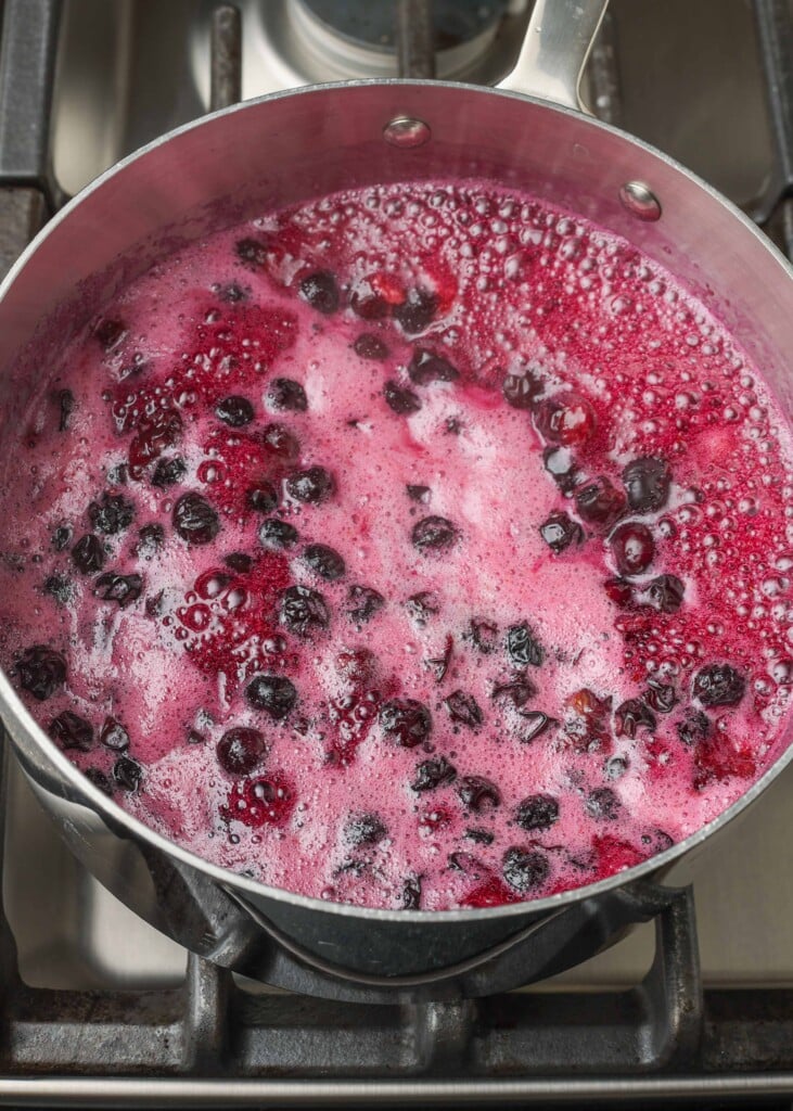 the blueberries have boiled in the pot, and are ready to reduce heat