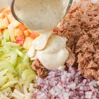 pasta salad ingredients with tuna, apple, celery, onion, and a creamy dressing