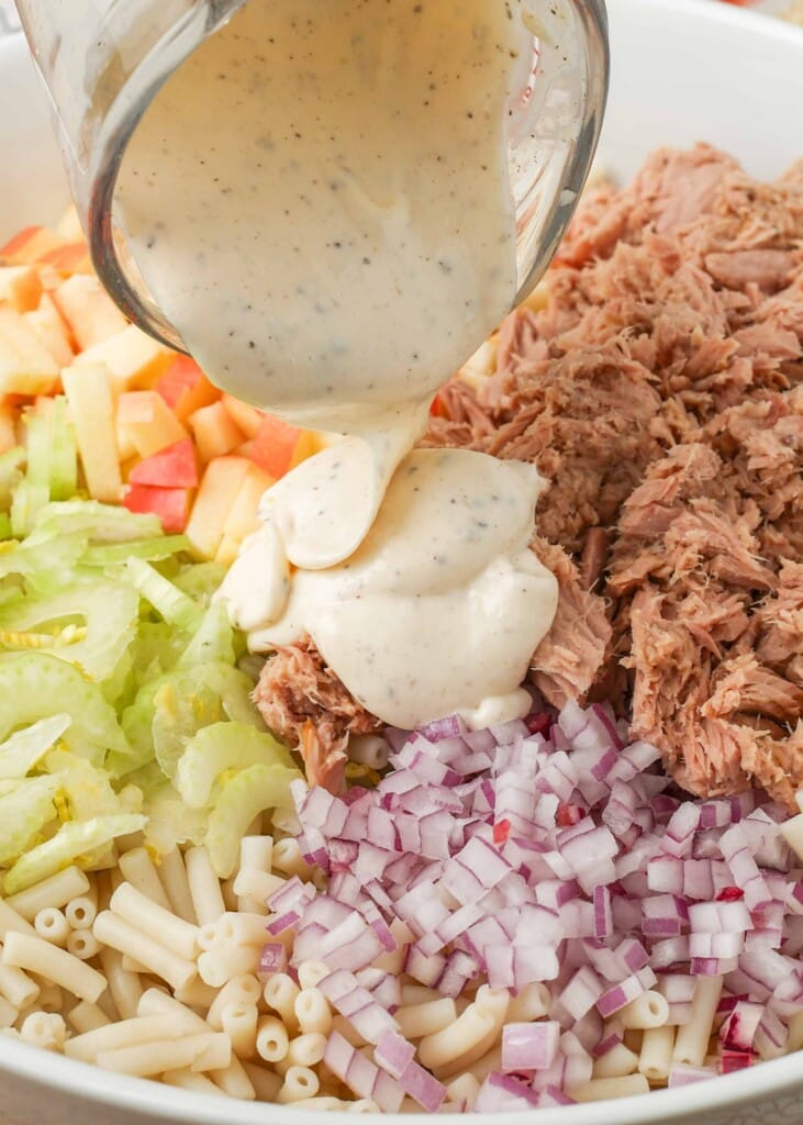 pasta salad ingredients with tuna, apple, celery, onion, and a creamy dressing