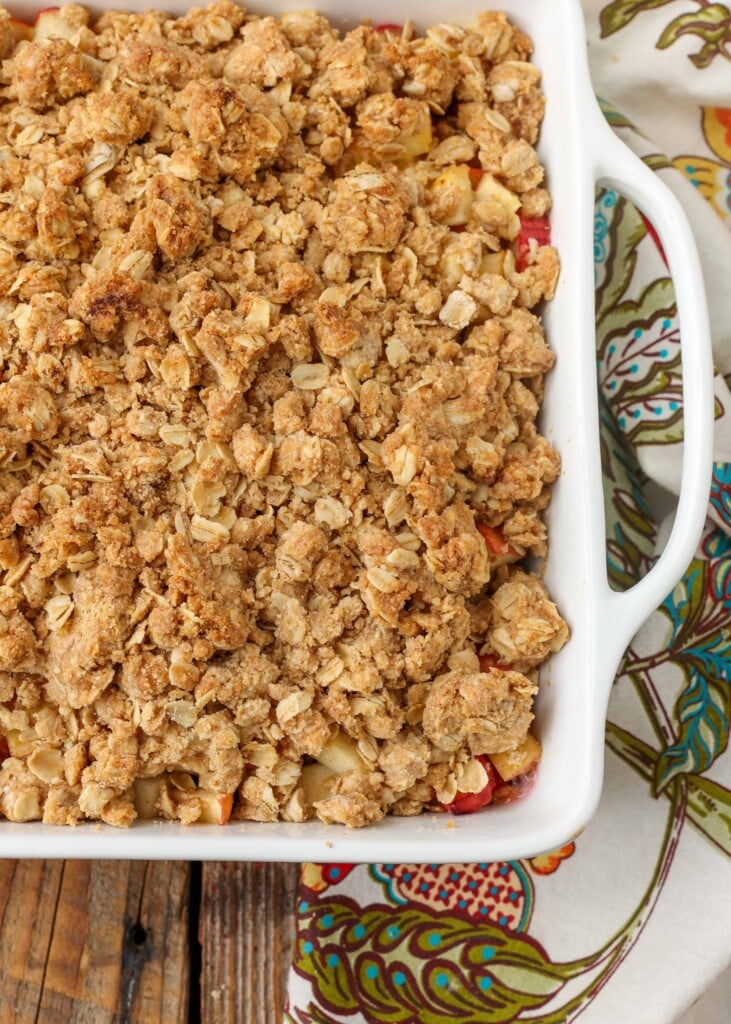 baked fruit crisp on table with flowered napkin