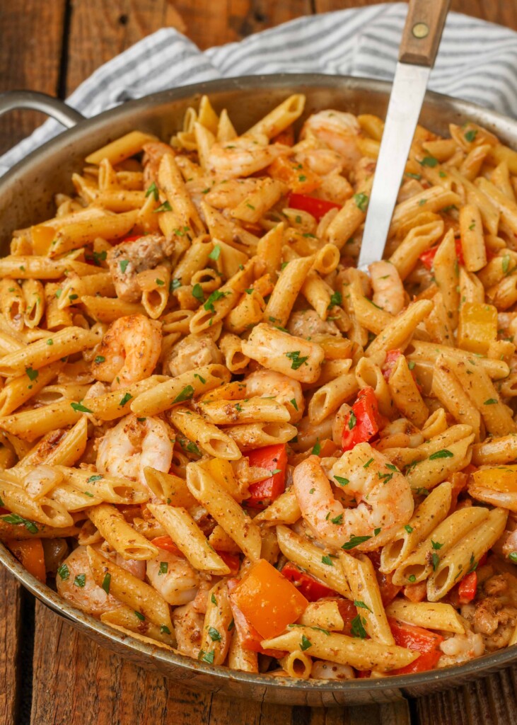 Overhead shot of creamy pasta with shrimp and bell peppers