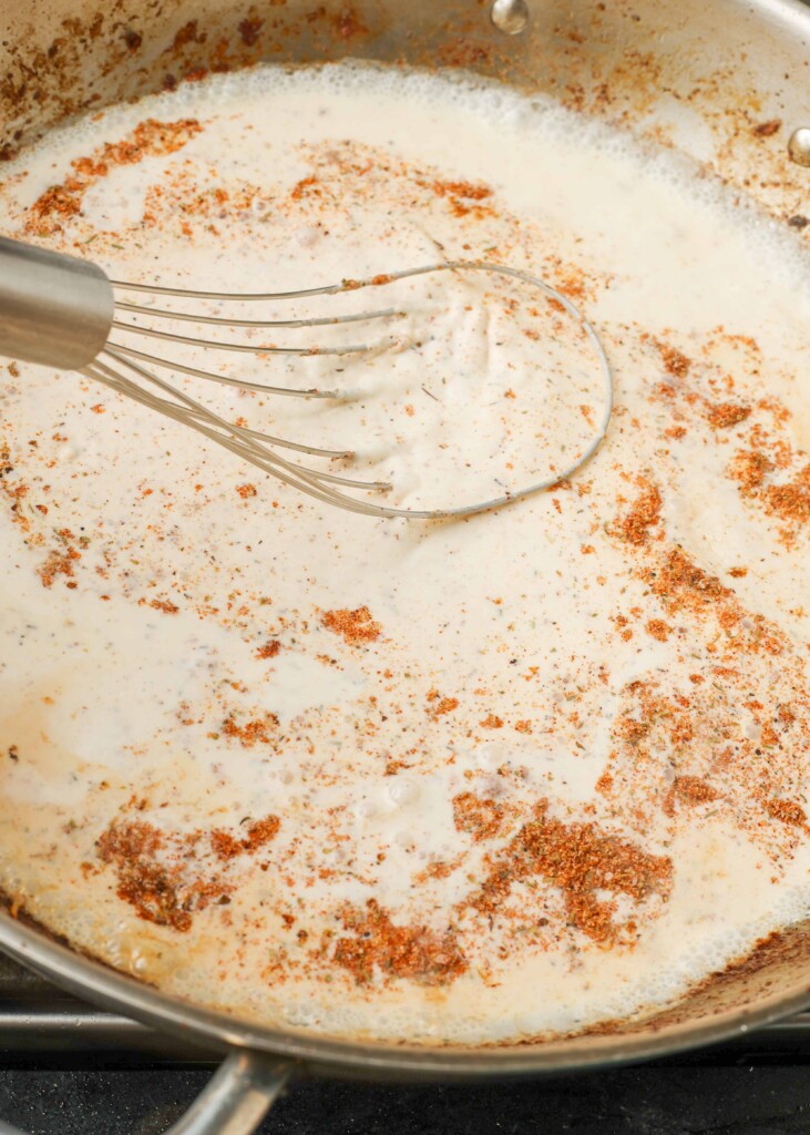 Making cream sauce in stovetop pan