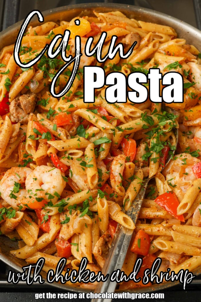 Overhead shot of creamy pasta with shrimp and bell peppers; the words "Cajun Pasta with chicken and shrimp" are superimposed over the image