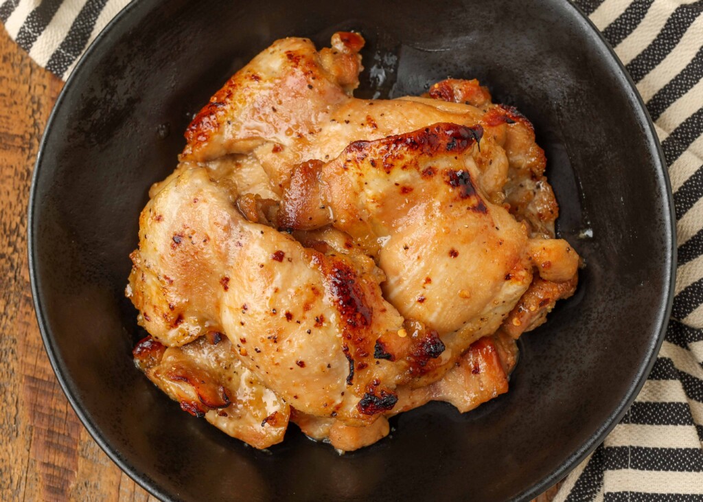 baked chicken in black bowl