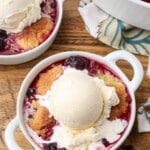 overhead photo of berry cobbler with ice cream