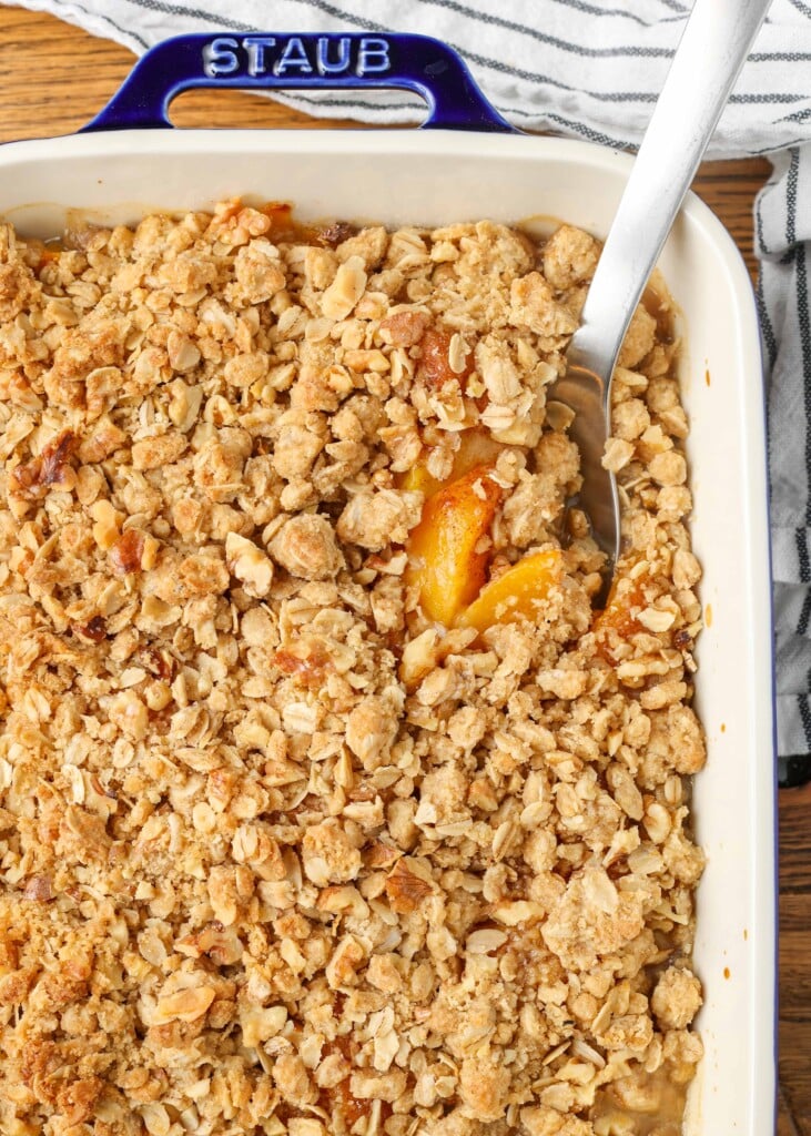 peach crisp in blue edged baking dish