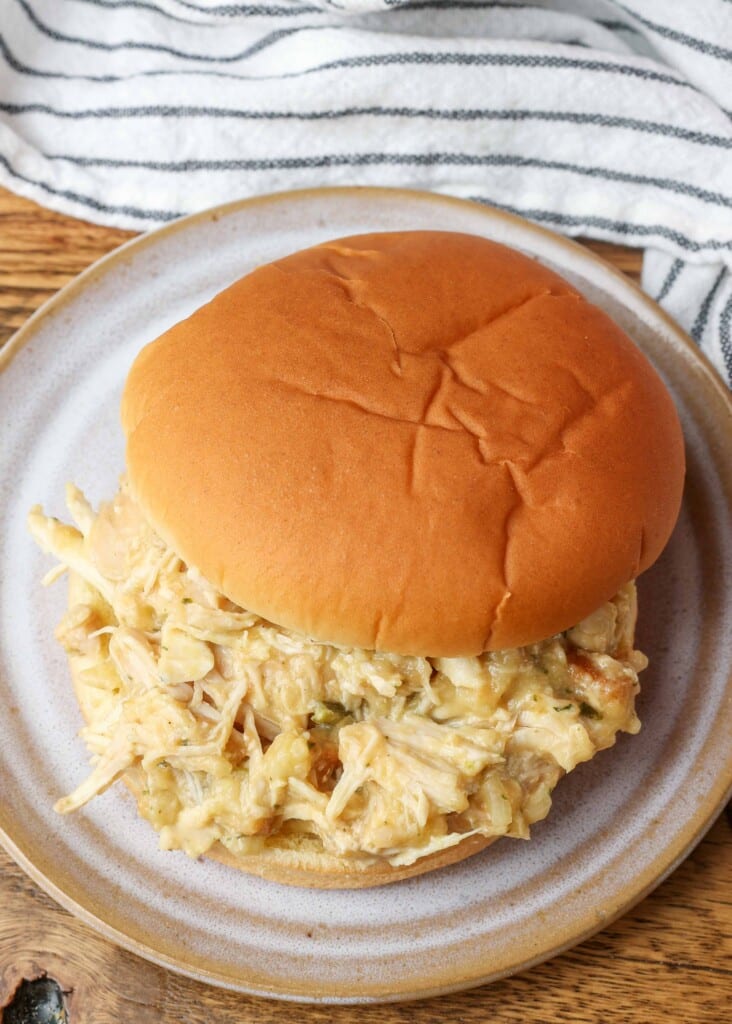 sandwich filled with creamy shredded chicken on plate