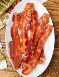 brown sugar candied bacon on oval plate