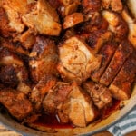 dutch oven roasted pork shoulder in a blue dutch oven