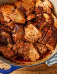 dutch oven roasted pork shoulder in a blue dutch oven