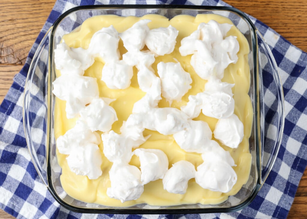 scoops of meringue toppping over pudding