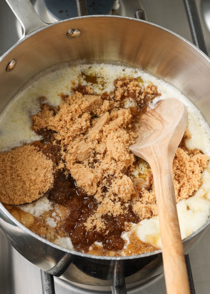 brown sugar being melted into butter in a saucepan