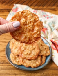 lacey thin oatmeal cookies held in hand