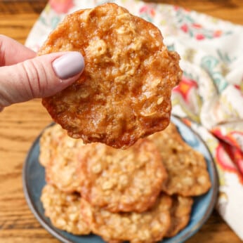 lacey thin oatmeal cookies held in hand