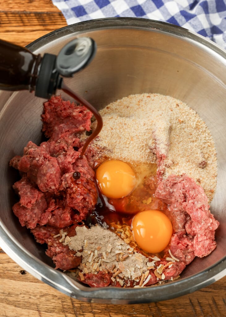 worcestershire sauce being added to meatloaf ingredients