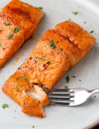 brown sugar salmon on a plate with a fork