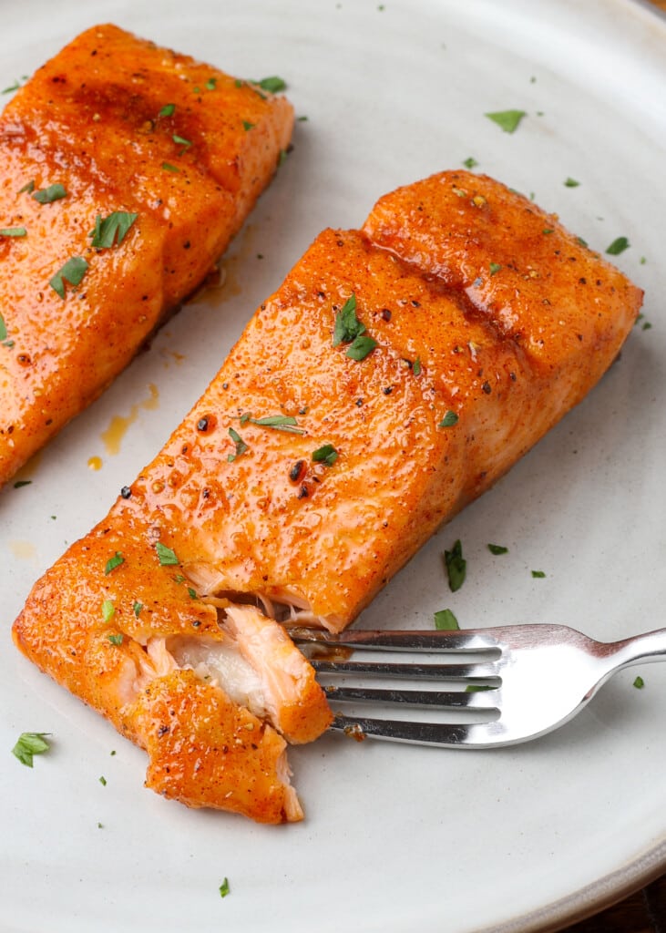 brown sugar salmon on a plate with a fork