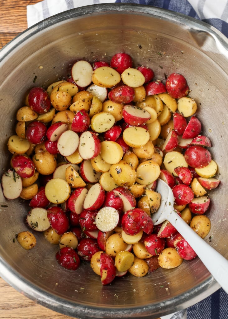 rosemary garlic roasted potatoes in a mixing bowl