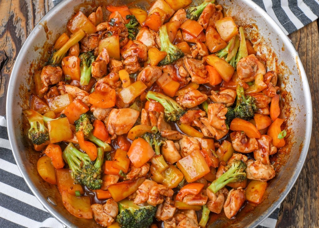 chicken and vegetables in large stainless skillet