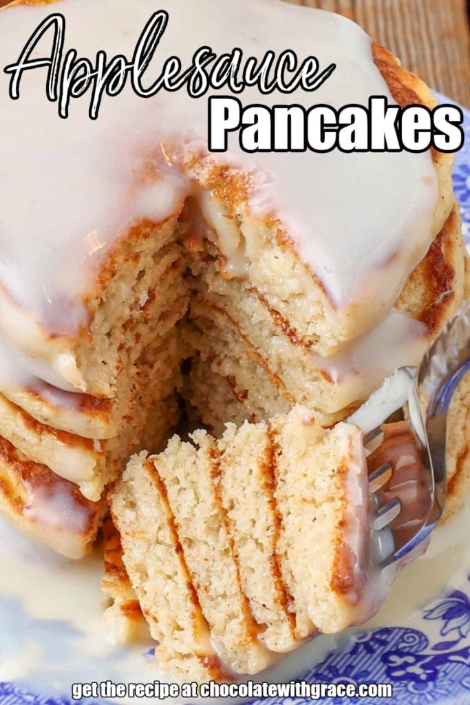 stacked pancakes on plate with stacked bite on fork
