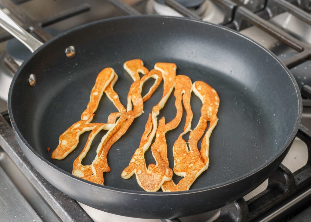 spaghetti pancakes in skillet