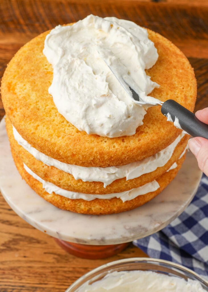 frosting the layers of the cake