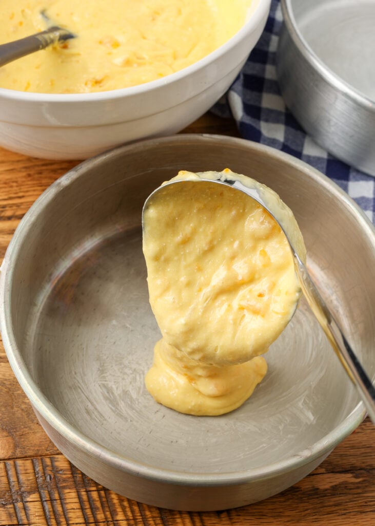 dividing the batter into cake pans